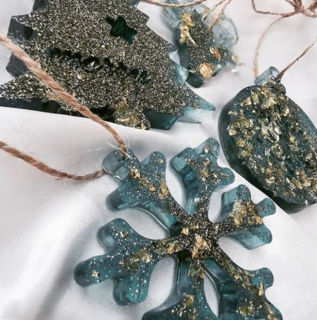 Gold flakes set off these translucent, icy blue epoxy-casted ornaments.