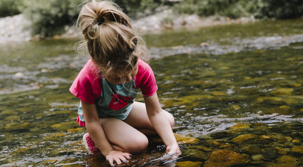 nature little girl in creek